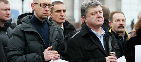 Ukrainian President Petro Poroshenko (R, front) and Prime Minister Arseny Yatseniuk (L, front) take part in a peace march in tribute to the victims onboard a passenger bus, which came under fire near the town of Volnovakha, in Kiev, January 18, 2015. Ukrainian President Petro Poroshenko (R, front) and Prime Minister Arseny Yatseniuk (L, front) take part in a peace march in tribute to the victims onboard a passenger bus, which came under fire near the town of Volnovakha, in Kiev, January 18, 2015. - Sputnik International