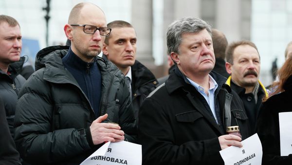 Ukrainian President Petro Poroshenko (R, front) and Prime Minister Arseny Yatseniuk (L, front) take part in a peace march in tribute to the victims onboard a passenger bus, which came under fire near the town of Volnovakha, in Kiev, January 18, 2015. Ukrainian President Petro Poroshenko (R, front) and Prime Minister Arseny Yatseniuk (L, front) take part in a peace march in tribute to the victims onboard a passenger bus, which came under fire near the town of Volnovakha, in Kiev, January 18, 2015. - Sputnik International