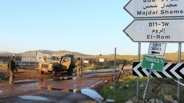 Israeli troops patrol the Israeli-occupied sector of the Golan Heights on January 18, 2015. An Israeli helicopter carried out a strike today against terrorists in the Syrian sector of the Golan Heights who were allegedly preparing an attack on Israel, an Israeli security source said. - Sputnik International