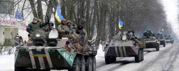 Members of the Ukrainian armed forces drive armored vehicles in the town of Volnovakha, eastern Ukraine, January 18, 2015. Members of the Ukrainian armed forces drive armored vehicles in the town of Volnovakha, eastern Ukraine, January 18, 2015. - Sputnik International