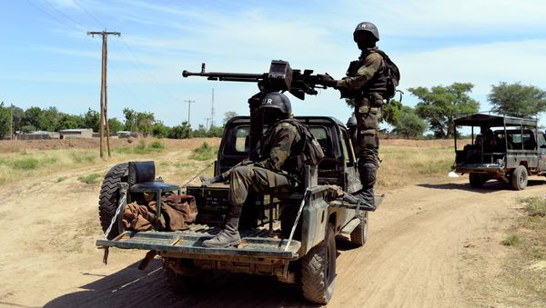 Cameroonian soldiers patrol in Amchide, northern Cameroon, 1 km from Nigeria Cameroonian soldiers patrol in Amchide, northern Cameroon, 1 km from Nigeria - Sputnik International