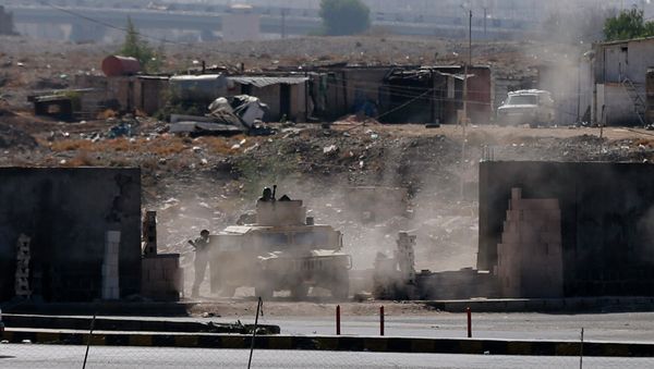 A vehicle from the Presidential Protection Forces is positioned on a street during clashes near the Presidential Palace in Sanaa - Sputnik International