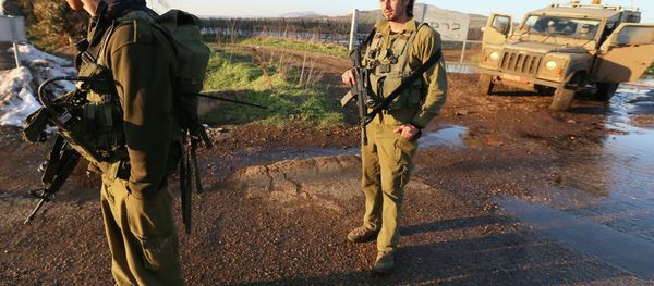 Israeli troops patrol the Israeli-occupied sector of the Golan Heights on January 18, 2015. - Sputnik International