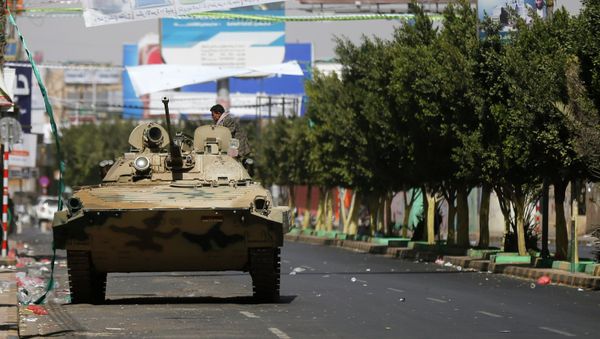 A Houthi fighter sits in a military vehicle belonging to Houthi fighters - Sputnik International