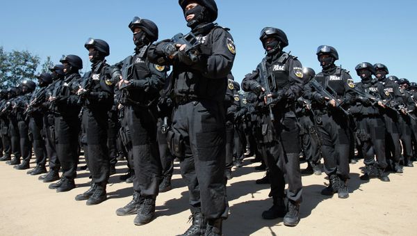 SWAT members of the Beijing Municipal Public Security Bureau stand in formation after conducting a joint anti-terrorism at a training ground on the outskirts of Beijing - Sputnik International