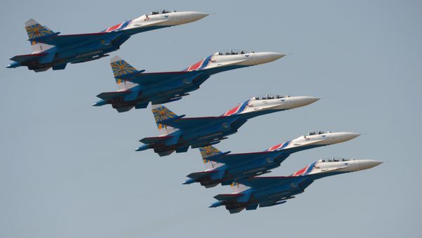 Su-27 fighter aircraft of the aerobatic display team Russkye Vityazi (Russian Knights) during the Air Force Day celebration in Lipetsk. - Sputnik International