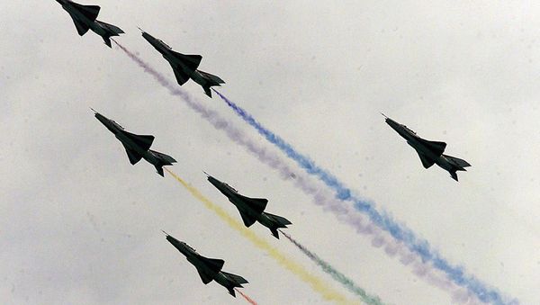 China's August 1st jet aerobatic squadron, the country's only military display team to fly high-performance aircraft, take their F-7E fighter aircraft to the skies on the opening day of Airshow 2000 in the southern Chinese city of Zhuhai - Sputnik International