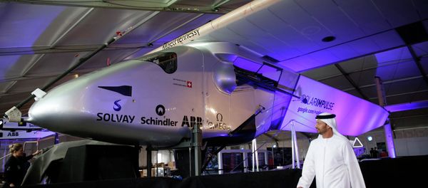 A man walks past the Solar Impulse 2 during its presentation at the Al Bateen airport in Abu Dhabi January 20, 2015. - Sputnik International