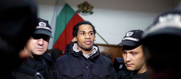 French citizen Fritz-Joly Joachin (C) arrives under police escort in front of a court in the southern city of Haskovo January 20, 2015. French citizen Fritz-Joly Joachin (C) arrives under police escort in front of a court in the southern city of Haskovo January 20, 2015. - Sputnik International