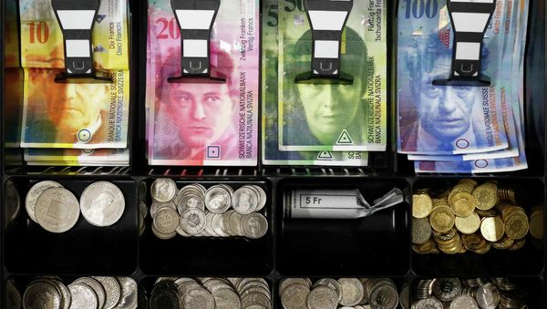 Swiss franc coins are seen in a cash drawer in this picture illustration in Bern Swiss franc coins are seen in a cash drawer in this picture illustration in Bern - Sputnik International