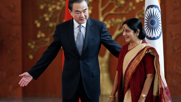 Indian External Affairs Minister Sushma Swaraj, right, and her Chinese counterpart, Wang Yi Indian External Affairs Minister Sushma Swaraj, right, and her Chinese counterpart, Wang Yi - Sputnik International