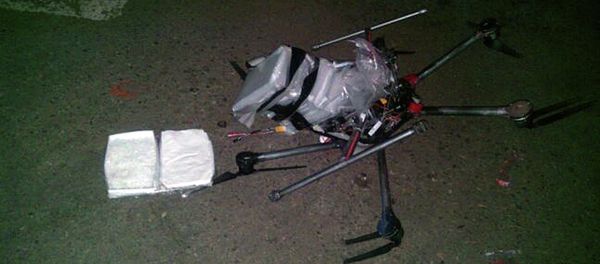 A drone loaded with packages containing methamphetamine lies on the ground after it crashed into a supermarket parking lot in the city of Tijuana on Tuesday Jan. 20, 2015 A drone loaded with packages containing methamphetamine lies on the ground after it crashed into a supermarket parking lot in the city of Tijuana on Tuesday Jan. 20, 2015 - Sputnik International