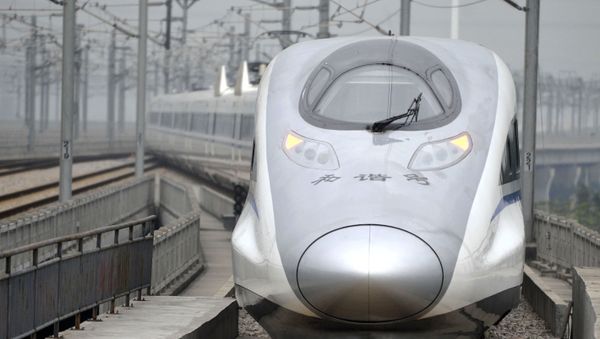 In this photo released by China's Xinhua news agency, a bullet train G80 leaves for Beijing from the Guangzhou South Railway Station in Guangzhou In this photo released by China's Xinhua news agency, a bullet train G80 leaves for Beijing from the Guangzhou South Railway Station in Guangzhou - Sputnik International