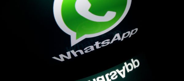 The logo of mobile app WhatsApp is displayed on a tablet on January 2, 2014 in Paris - Sputnik International