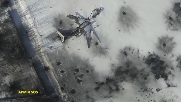Airplane in the snow at the Sergey Prokofiev International Airport damaged by shelling during fighting Airplane in the snow at the Sergey Prokofiev International Airport damaged by shelling during fighting - Sputnik International