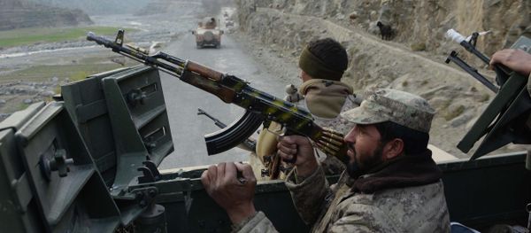 Afghan security personnel patrol during an ongoing anti-Taliban operation in Dangam district near the Pakistan-Afghanistan border in the eastern Kunar province Afghan security personnel patrol during an ongoing anti-Taliban operation in Dangam district near the Pakistan-Afghanistan border in the eastern Kunar province - Sputnik International