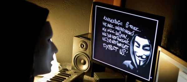 A masked hacker, part of the Anonymous group, hacks the French presidential Elysee Palace website on January 20, 2012 A masked hacker, part of the Anonymous group, hacks the French presidential Elysee Palace website on January 20, 2012 - Sputnik International