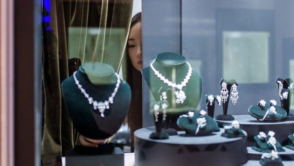 A vendor checks a display prior to the opening of the Hong Kong Jewellery and Gem fair at the convention and exhibition Centre on September 17, 2014 A vendor checks a display prior to the opening of the Hong Kong Jewellery and Gem fair at the convention and exhibition Centre on September 17, 2014 - Sputnik International