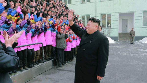 North Korean leader Kim Jong Un waves to a crowd as he provides field guidance to the Ryuwon Shoes Factory in this undated photo released by North Korea's Korean Central News Agency (KCNA) in Pyongyang January 21, 2015 North Korean leader Kim Jong Un waves to a crowd as he provides field guidance to the Ryuwon Shoes Factory in this undated photo released by North Korea's Korean Central News Agency (KCNA) in Pyongyang January 21, 2015 - Sputnik International