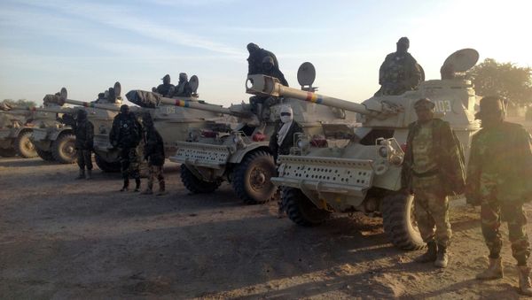 Soldiers of the Chadian army stand next to Panhard AML 90 armoured vehicles on January 21, 2015, at the border between Nigeria and Cameroon - Sputnik International