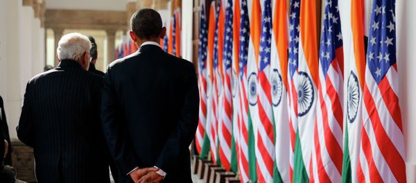 India's Prime Minister Narendra Modi and US President Barack Obama talk as they walk through Hyderabad House in New Delhi January 25, 2015 - Sputnik International