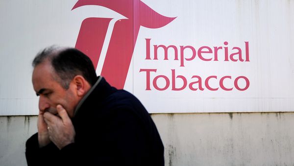 A man gives a phone call in front of the Seita-Imperial tobacco factory in Carquefou on April 15, 2014 A man gives a phone call in front of the Seita-Imperial tobacco factory in Carquefou on April 15, 2014 - Sputnik International