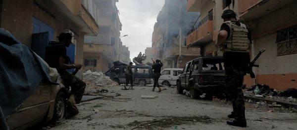 Libyan military soldiers check on an area as they battle with Islamic extremist militias in Benghazi Libyan military soldiers check on an area as they battle with Islamic extremist militias in Benghazi - Sputnik International