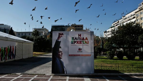 A flock of pigeons flies over a banner with an image of opposition leader and head of radical leftist Syriza party Alexis Tsipras at the party's pre-election kiosk in Athens January 15, 2015. A flock of pigeons flies over a banner with an image of opposition leader and head of radical leftist Syriza party Alexis Tsipras at the party's pre-election kiosk in Athens January 15, 2015. - Sputnik International