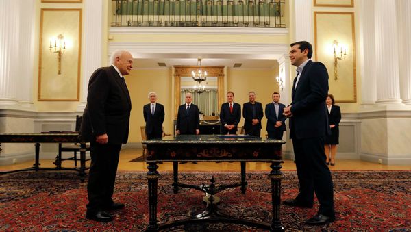 Head of radical leftist Syriza party and winner of the Greek parliamentary elections Alexis Tsipras (R) stands in front of Greek President Karolos Papoulias in the Presidential Palace in Athens during a swearing in ceremony as Greece's first leftist Prime Minister - Sputnik International