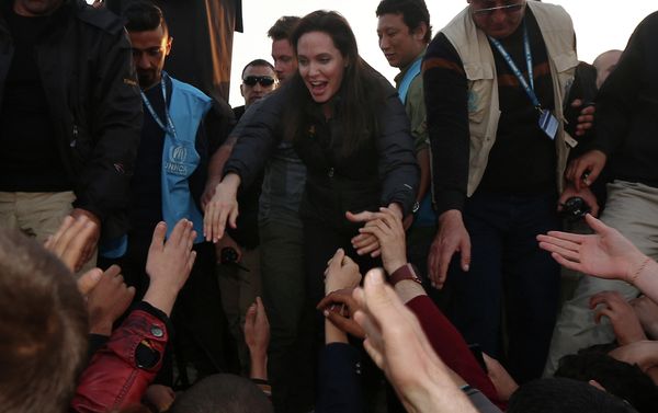 US actress and UNHCR ambassador Angelina Jolie (C) greets displaced Iraqi children during a visit to a camp for displaced people in Khanke, a few kilometres (miles) from the Turkish border in Iraq's Dohuk province US actress and UNHCR ambassador Angelina Jolie (C) greets displaced Iraqi children during a visit to a camp for displaced people in Khanke, a few kilometres (miles) from the Turkish border in Iraq's Dohuk province - Sputnik International