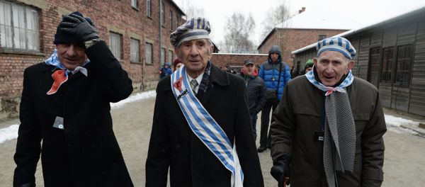 Former inmates of the Auschwitz-Birkenau concentration camp, during a memorial event marking the 70th anniversary of the camp's liberation, in Oswiecim - Sputnik International