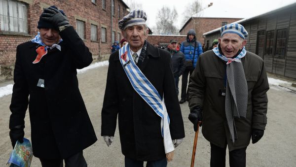 Former inmates of the Auschwitz-Birkenau concentration camp, during a memorial event marking the 70th anniversary of the camp's liberation, in Oswiecim - Sputnik International