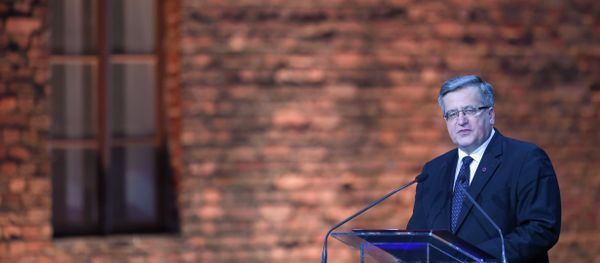 Poland's President Bronislaw Komorowski delivers a speech at a tent erected in front of the entrance of the former Nazi concentration camp Auschwitz-Birkenau during the main ceremony to mark the 70th anniversary of the liberation of the death camp on January 27, 2015 in Oswiecim, Poland. Poland's President Bronislaw Komorowski delivers a speech at a tent erected in front of the entrance of the former Nazi concentration camp Auschwitz-Birkenau during the main ceremony to mark the 70th anniversary of the liberation of the death camp on January 27, 2015 in Oswiecim, Poland. - Sputnik International