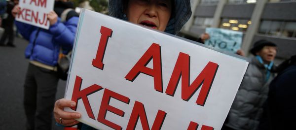 Protesters holding placards chant Save Kenji during a demonstration in front of the Prime Minister's Official residence in Tokyo Protesters holding placards chant Save Kenji during a demonstration in front of the Prime Minister's Official residence in Tokyo - Sputnik International