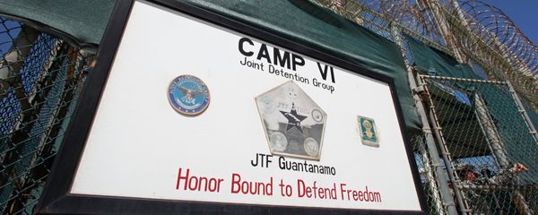 A guard opens the gate at the entrance to Camp VI, a prison used to house detainees at the US Naval Base at Guantanamo Bay A guard opens the gate at the entrance to Camp VI, a prison used to house detainees at the US Naval Base at Guantanamo Bay - Sputnik International