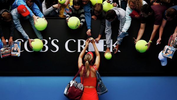 Maria Sharapova of Russia signs autographs after defeating Eugenie Bouchard of Canada in their women's singles quarter-final match at the Australian Open 2015 tennis tournament in Melbourne Maria Sharapova of Russia signs autographs after defeating Eugenie Bouchard of Canada in their women's singles quarter-final match at the Australian Open 2015 tennis tournament in Melbourne - Sputnik International