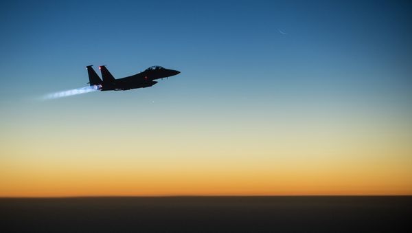 A US Air Force F-15E Strike Eagle aircraft flies over northern Iraq Sept. 23, 2014 A US Air Force F-15E Strike Eagle aircraft flies over northern Iraq Sept. 23, 2014 - Sputnik International