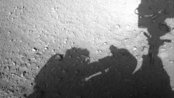 This image is believed to have captured the shadow of human shaped workman on Mars fixing the Rover This image is believed to have captured the shadow of human shaped workman on Mars fixing the Rover - Sputnik International