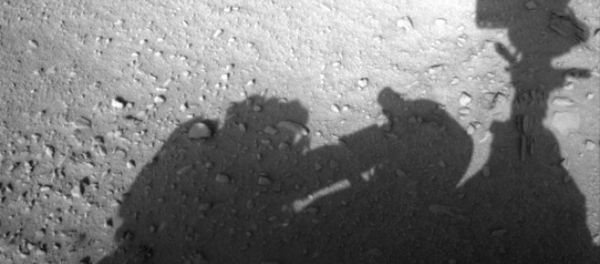 This image is believed to have captured the shadow of human shaped workman on Mars fixing the Rover This image is believed to have captured the shadow of human shaped workman on Mars fixing the Rover - Sputnik International
