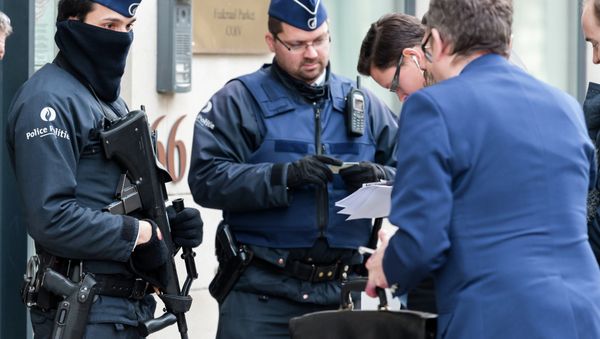 Police checks the identity of people who want to enter a government building in Brussels, Friday, Jan. 16, 2015 Police checks the identity of people who want to enter a government building in Brussels, Friday, Jan. 16, 2015 - Sputnik International