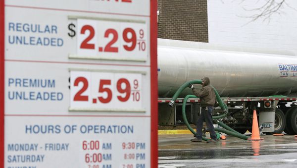 A fuel tanker truck driver stores his hoses after a gasoline delivery at the Costco in Beltsville, Maryland A fuel tanker truck driver stores his hoses after a gasoline delivery at the Costco in Beltsville, Maryland - Sputnik International