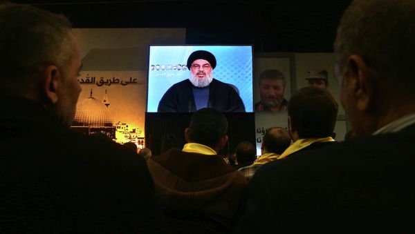 Hezbollah leader Sheikh Hassan Nasrallah, speaks via video link to his supporters Hezbollah leader Sheikh Hassan Nasrallah, speaks via video link to his supporters - Sputnik International