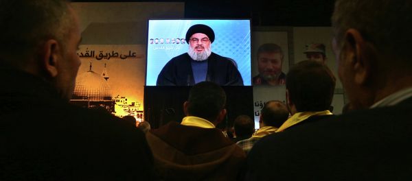 Hezbollah leader Sheikh Hassan Nasrallah, speaks via video link to his supporters - Sputnik International