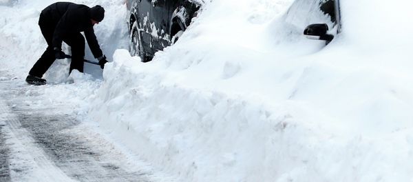 Max Gomez shovels his vehicle out at his home in Boston's Charlestown section, Wednesday, Jan. 28, 2015, one day after a blizzard dumped about two feet of snow in the city - Sputnik International