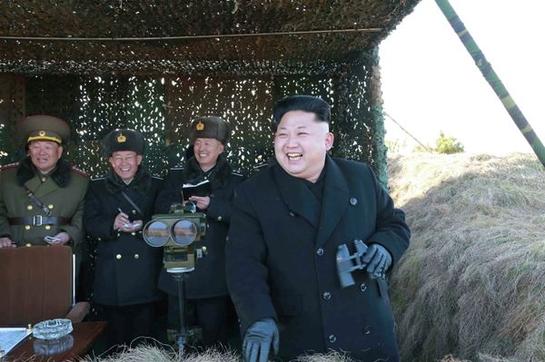 North Korean leader Kim Jong Un (R) laughs as he watches a drill by the Korean People's Army (KPA) for hitting enemy naval target at undisclosed location in this undated photo released by North Korea's Korean Central News Agency (KCNA) in Pyongyang January 31, 2015 - Sputnik International