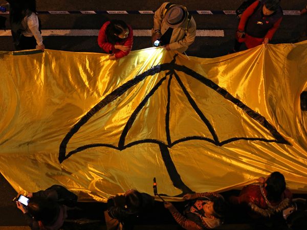 Protesters carry a long yellow banner during a march with an umbrella -- a recent symbol of Hong Kong's democracy movement Protesters carry a long yellow banner during a march with an umbrella -- a recent symbol of Hong Kong's democracy movement - Sputnik International