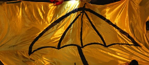 Protesters carry a long yellow banner during a march with an umbrella -- a recent symbol of Hong Kong's democracy movement - Sputnik International
