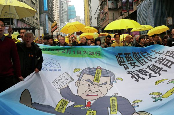 Activists carry a banner depicting Hong Kong Chief Executive Leung Chun-ying during a march to Central, demanding for universal suffrage in Hong Kong Sunday, Feb. 1, 2015 Activists carry a banner depicting Hong Kong Chief Executive Leung Chun-ying during a march to Central, demanding for universal suffrage in Hong Kong Sunday, Feb. 1, 2015 - Sputnik International