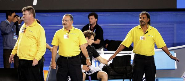 Andy Murray of Britain, center, is guarded by security guards as political protesters are taken away from Rod Laver Arena during his men's singles final against Novak Djokovic of Serbia - Sputnik International