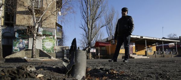 A man looks at Grad rocket louncher system after shelling November 23, 2014 in eastern Ukrainian city of Debalcevo A man looks at Grad rocket louncher system after shelling November 23, 2014 in eastern Ukrainian city of Debalcevo - Sputnik International